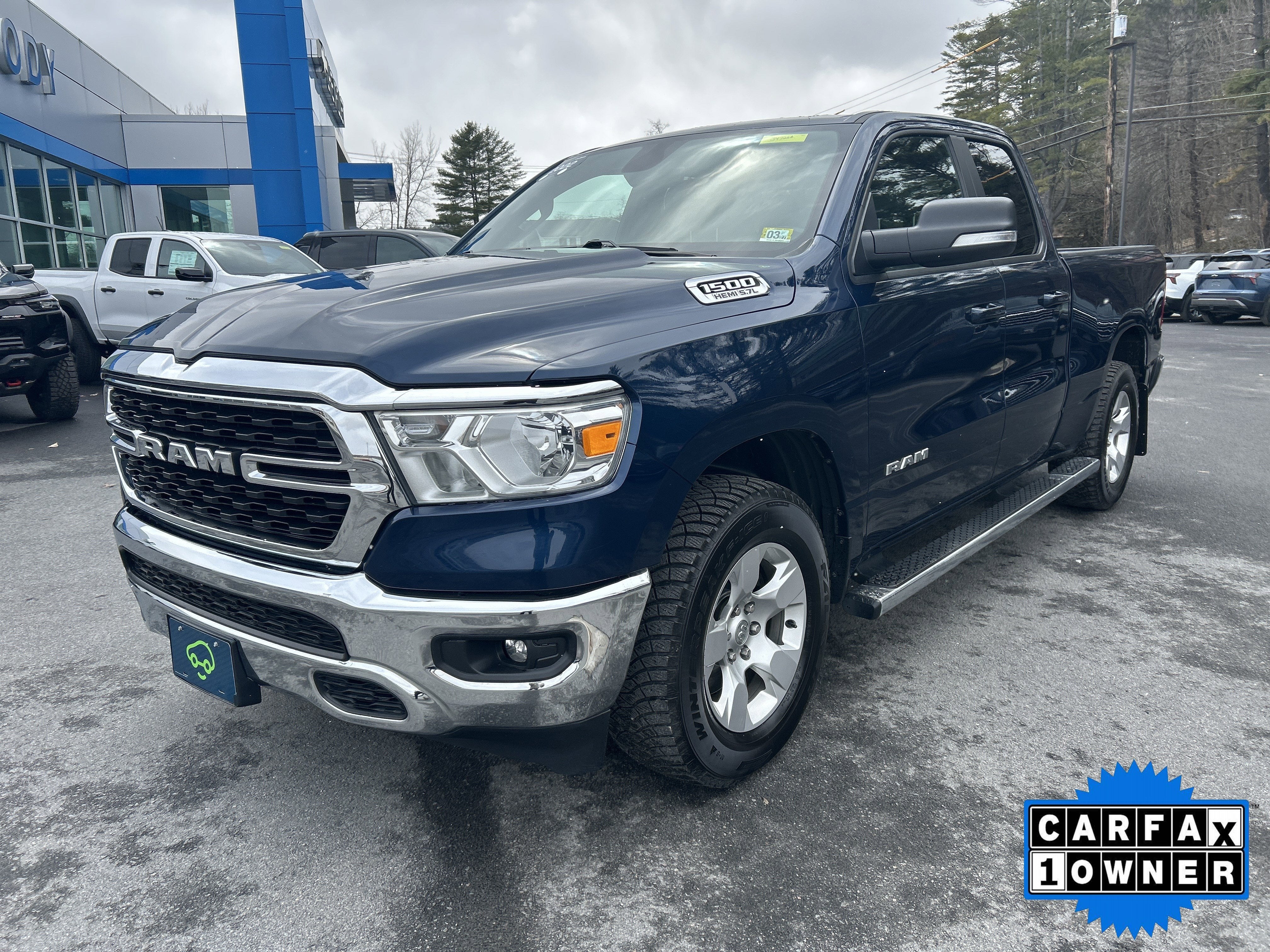 2022 RAM 1500 Big Horn Quad Cab 4x4 6'4" Box in Blue — front three-quarter view
