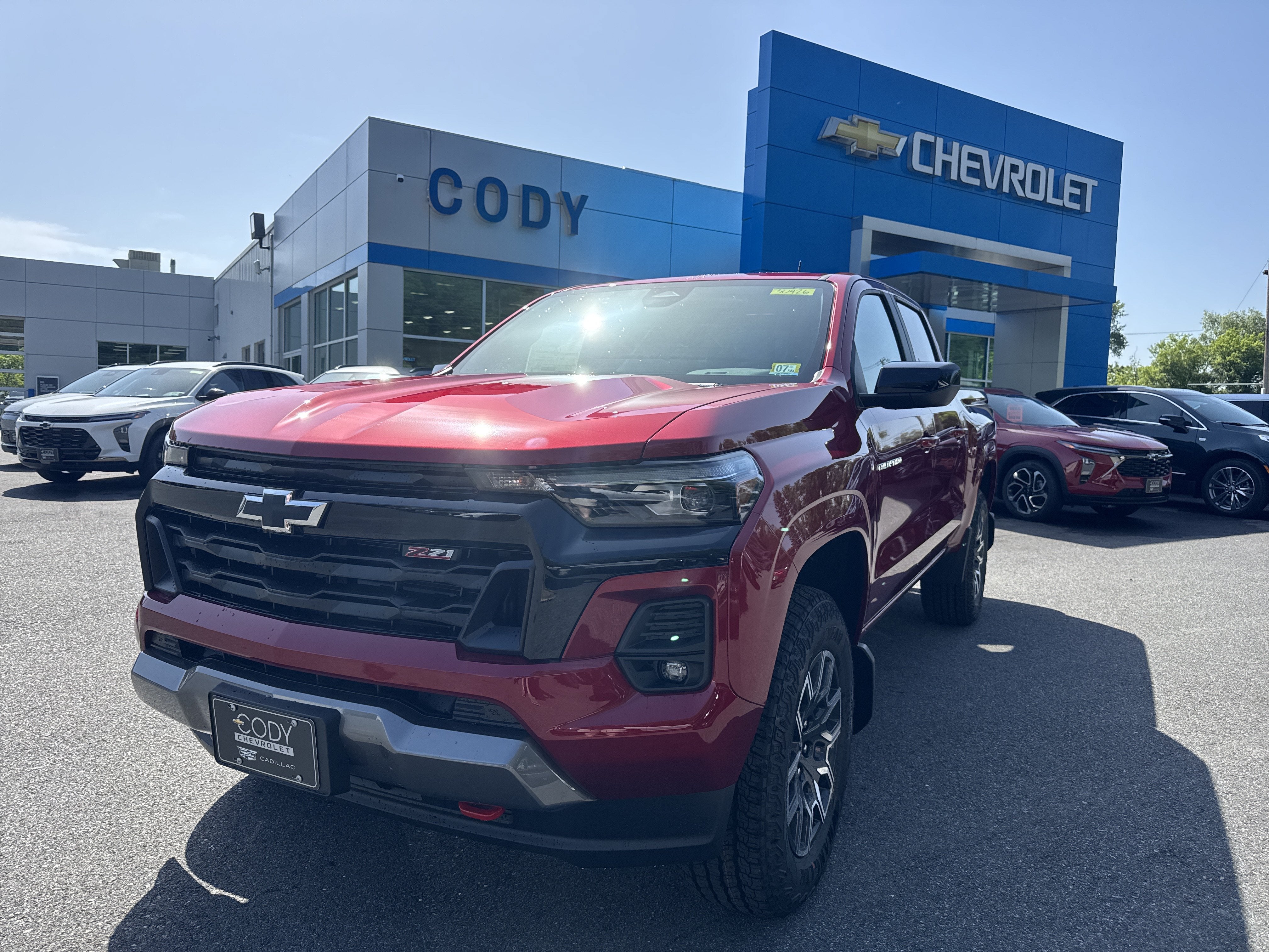 2026 Chevrolet Colorado Z71 in Radiant Red Tintcoat — front three-quarter view
