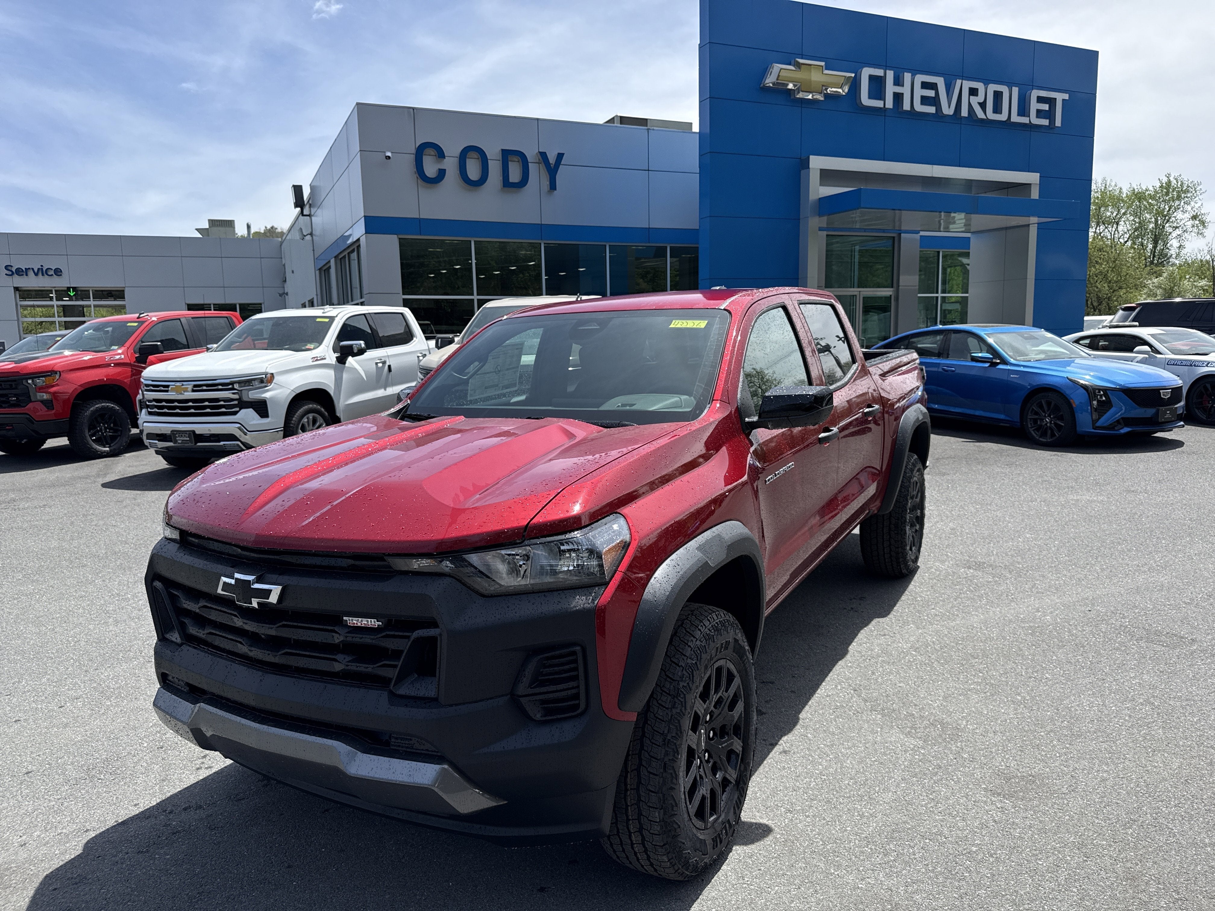 2026 Chevrolet Colorado Trail Boss in Radiant Red Tintcoat — front three-quarter view