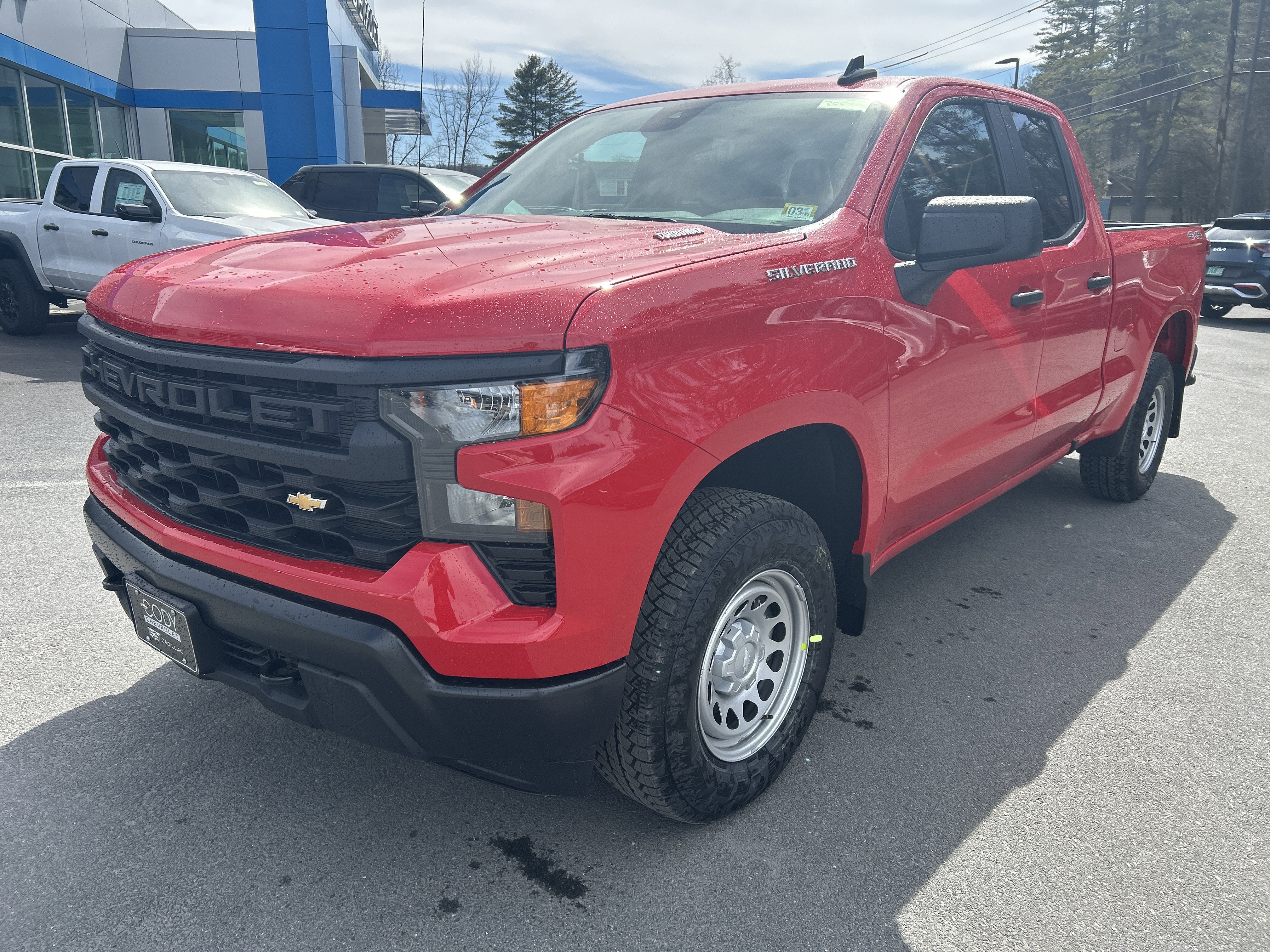 2026 Chevrolet Silverado 1500 WT in Red Hot — front three-quarter view