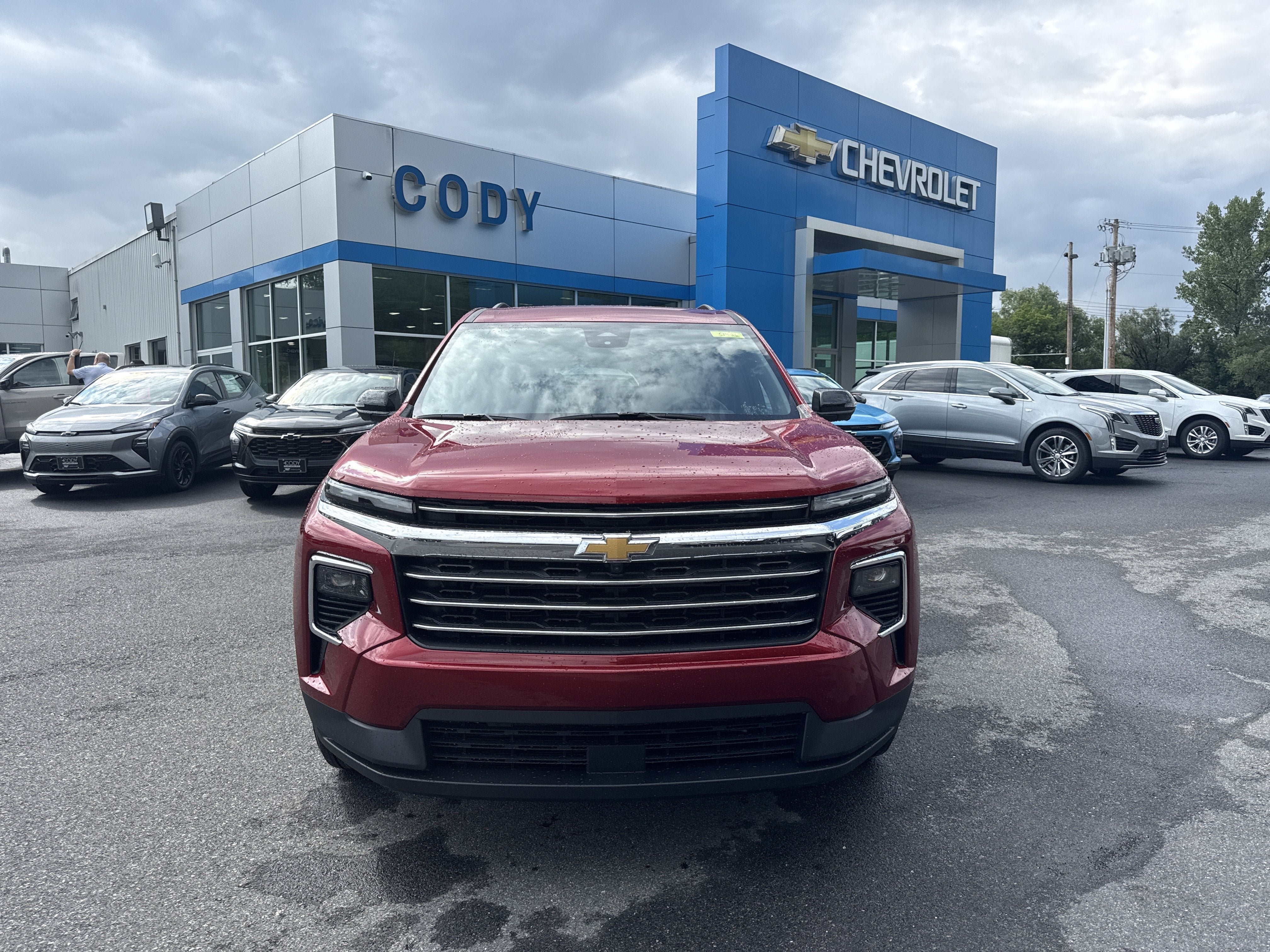 2026 Chevrolet Traverse LT in Radiant Red Tintcoat — front three-quarter view