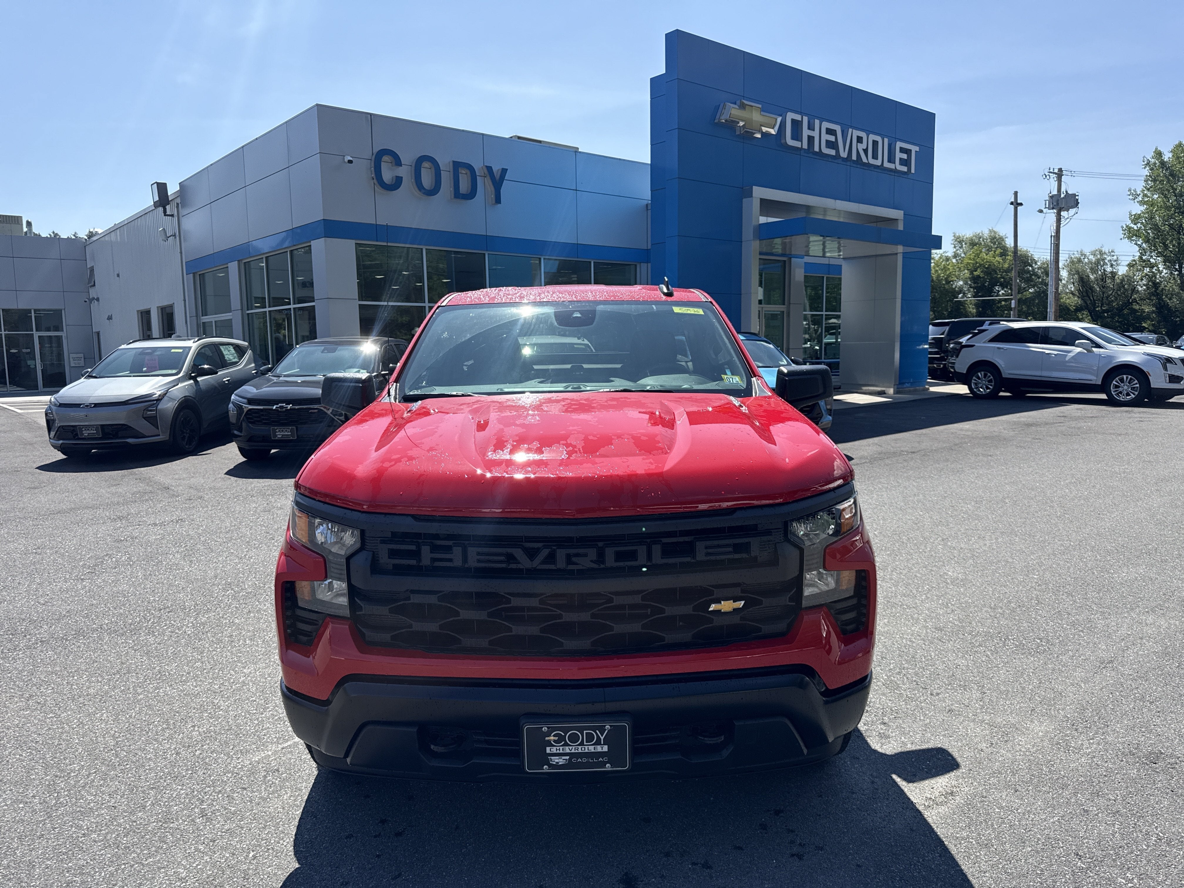 2026 Chevrolet Silverado 1500 WT in Red Hot — front three-quarter view