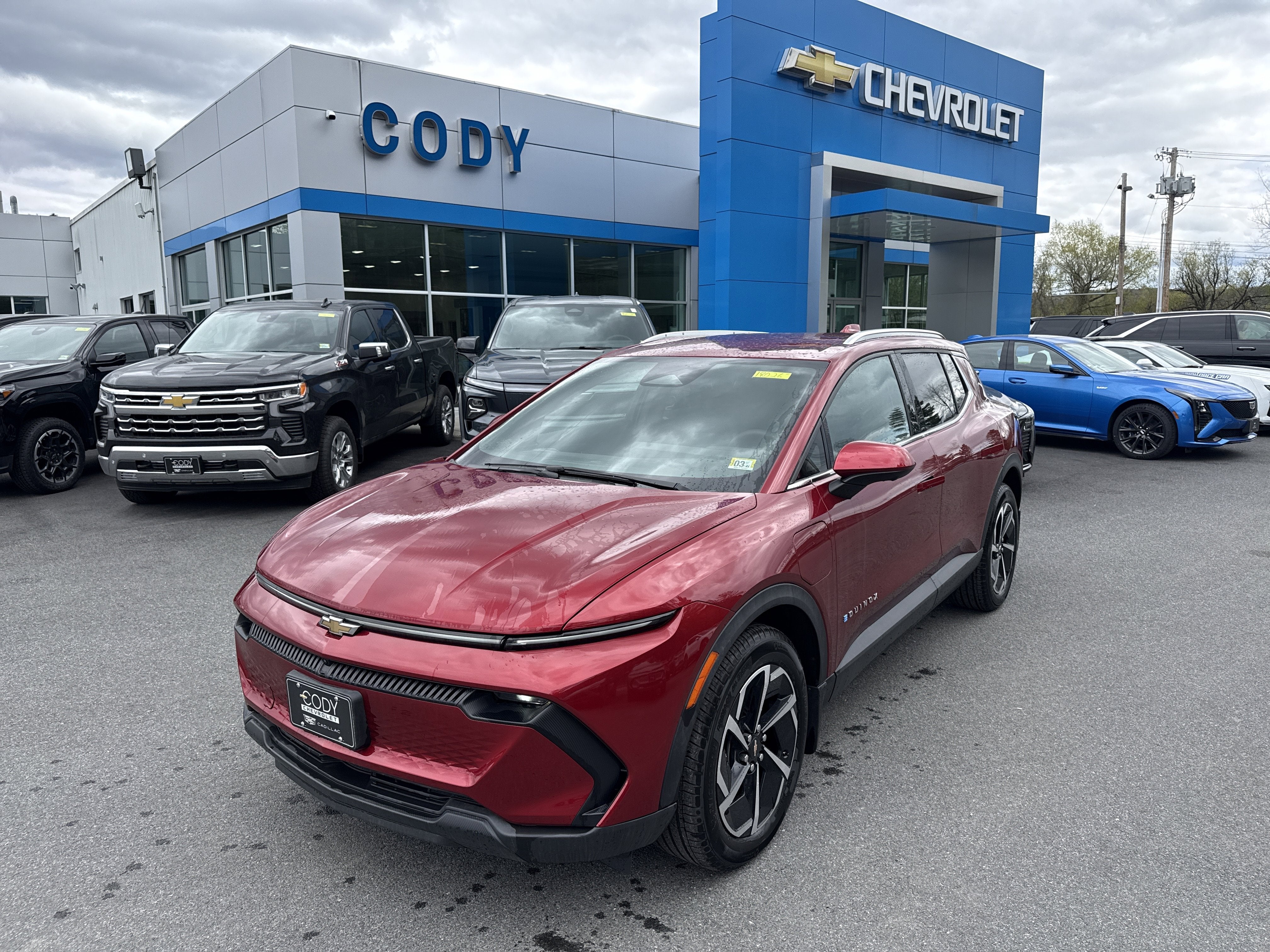 2026 Chevrolet Equinox EV LT in Radiant Red Tintcoat — front three-quarter view