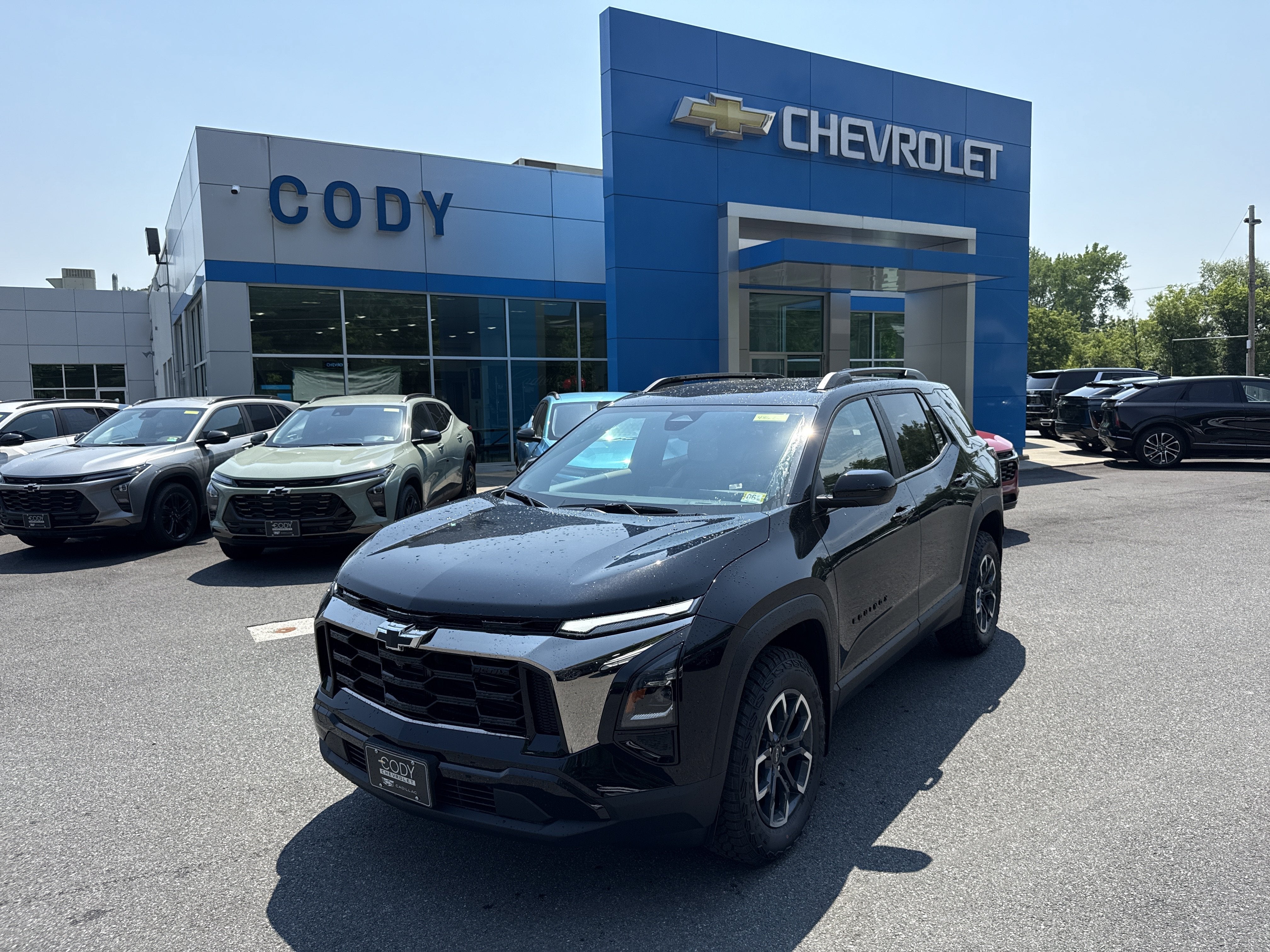 2026 Chevrolet Equinox ACTIV in Mosaic Black Metallic — front three-quarter view