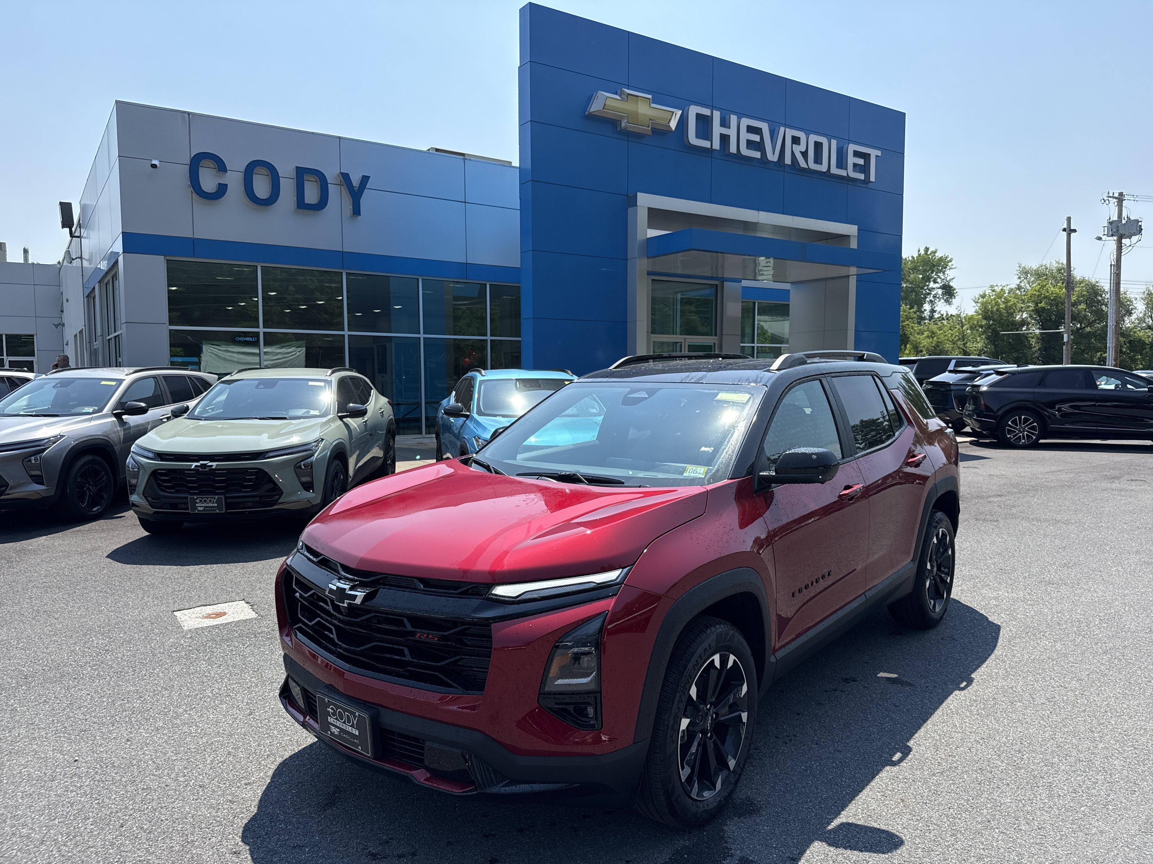 2026 Chevrolet Equinox RS in Radiant Red Tintcoat — front three-quarter view