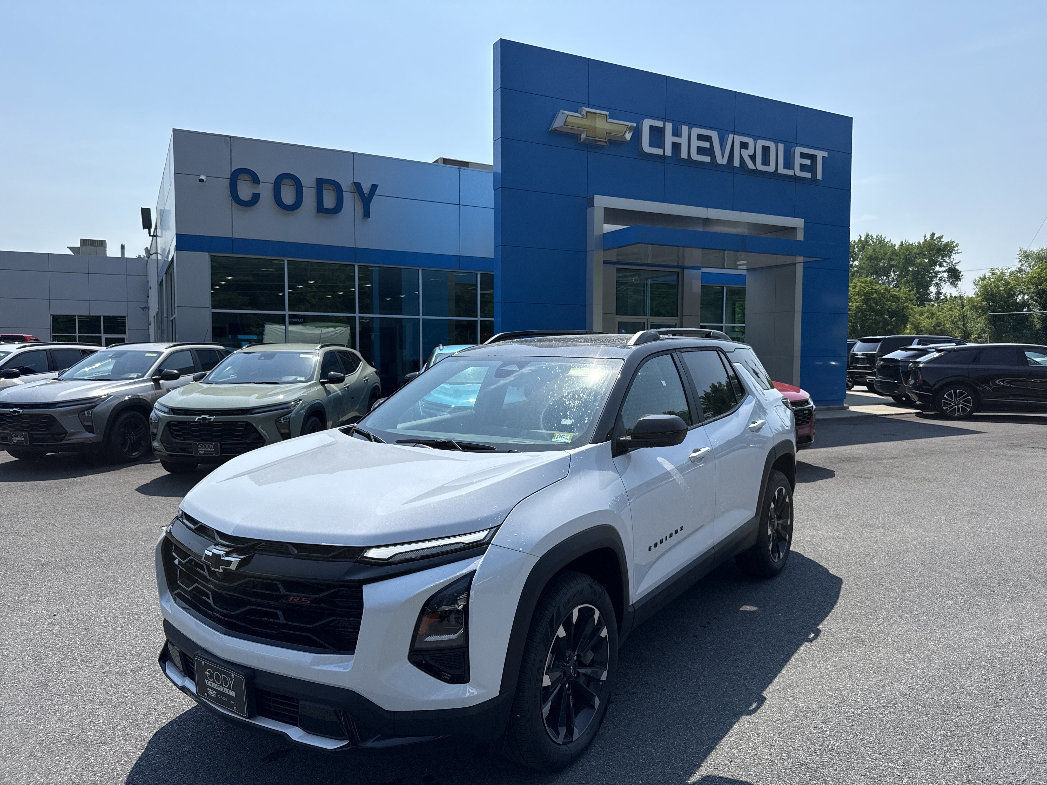 2026 Chevrolet Equinox RS in Polar White Tricoat — front three-quarter view